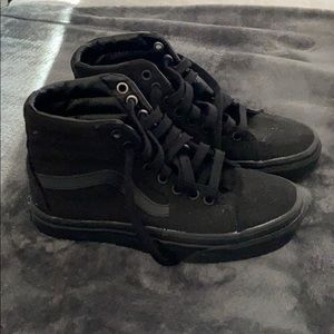 All black high top Vans